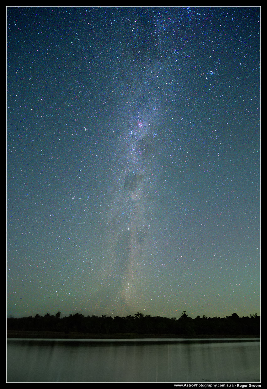 Southern Cross and milky way above Lake Leschenaultia's tranquil water.