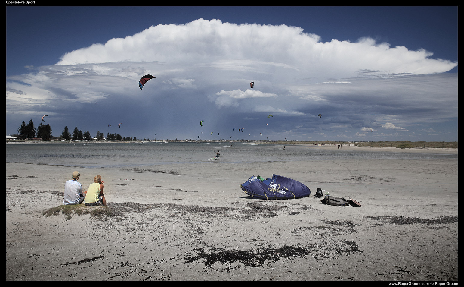 Spectator Sport - The Pond at Safety Bay, with storm clouds in the distance and kite surfers.